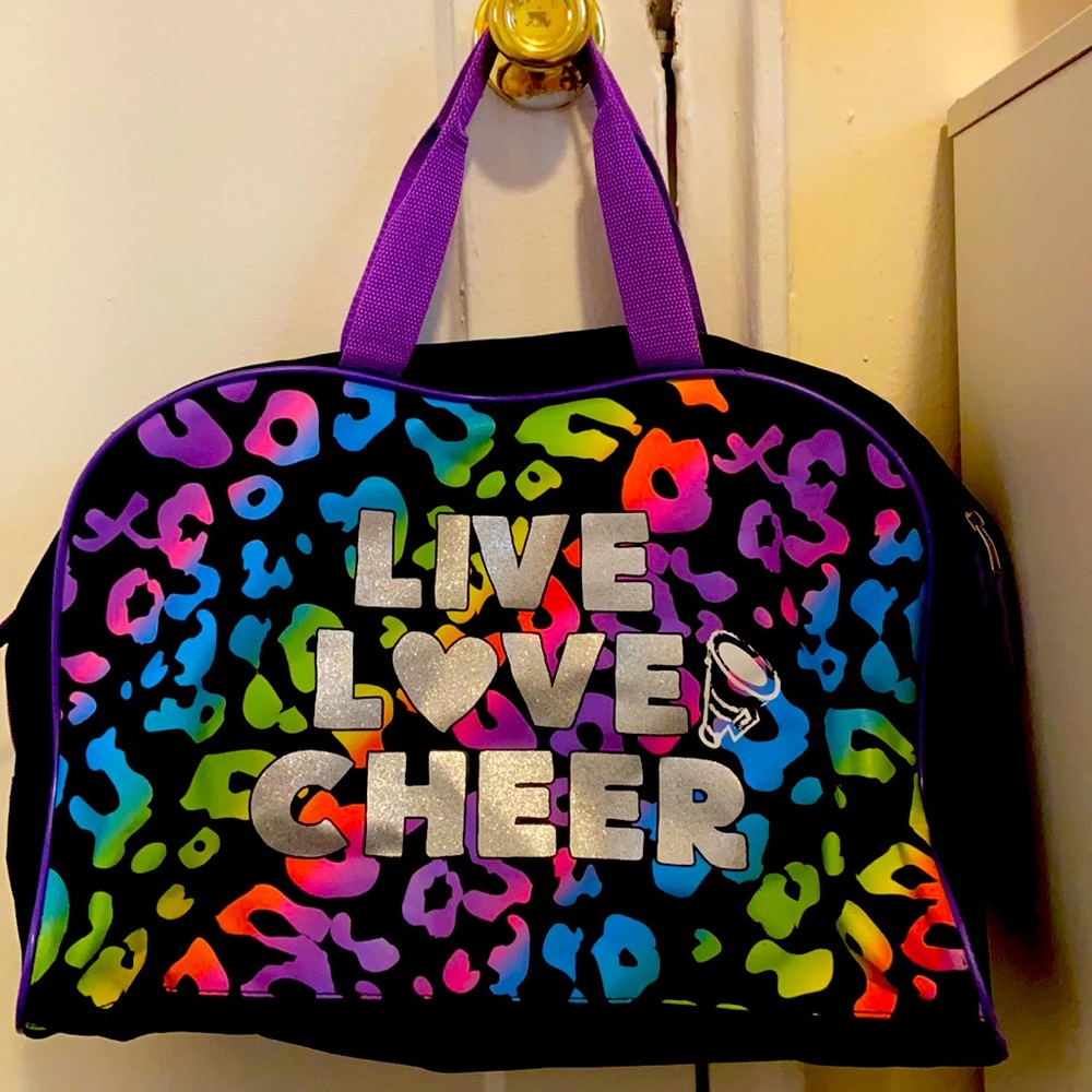 A large sports bag with colorful cheetah designs.